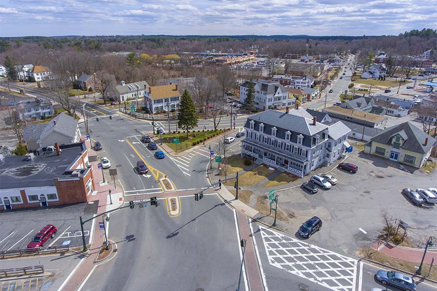 Chelmsford, MA - Aerial View of Downtown Chelmsford Massachuetts with View of Commercial Buildings and Homes During the Winter